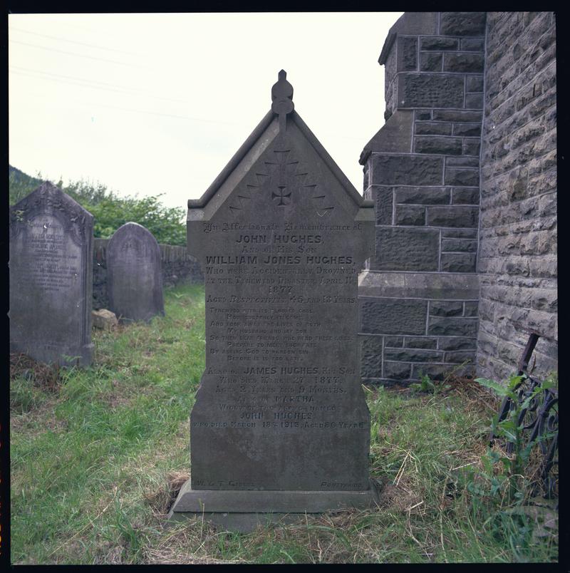 Gravestone of John Hughes (father) and William John Hughes (son), victims of the 1877 Tynewydd Pit Disaster at St. Davids Church, Hopkinstown.