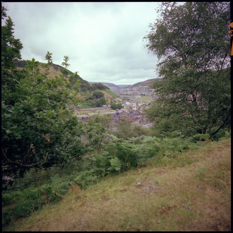 Colour film negative showing a view towards Six Bells Colliery.  &#039;Six Bells&#039; is transcribed from original negative bag.  Appears to be identical to 2009.3/1900.