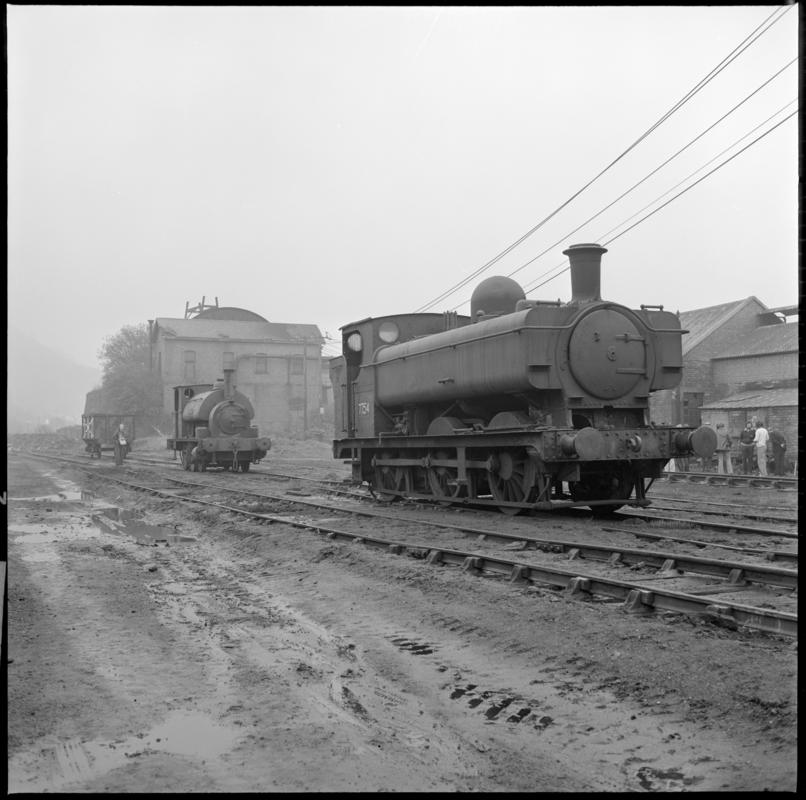 Black and white film negative showing locomotives at a locomotive shed, Mountain Ash.