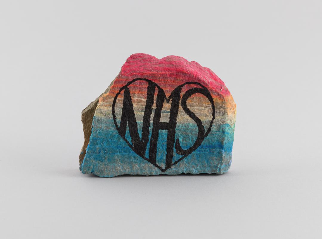 Stone painted with inscription &#039;NHS&#039;