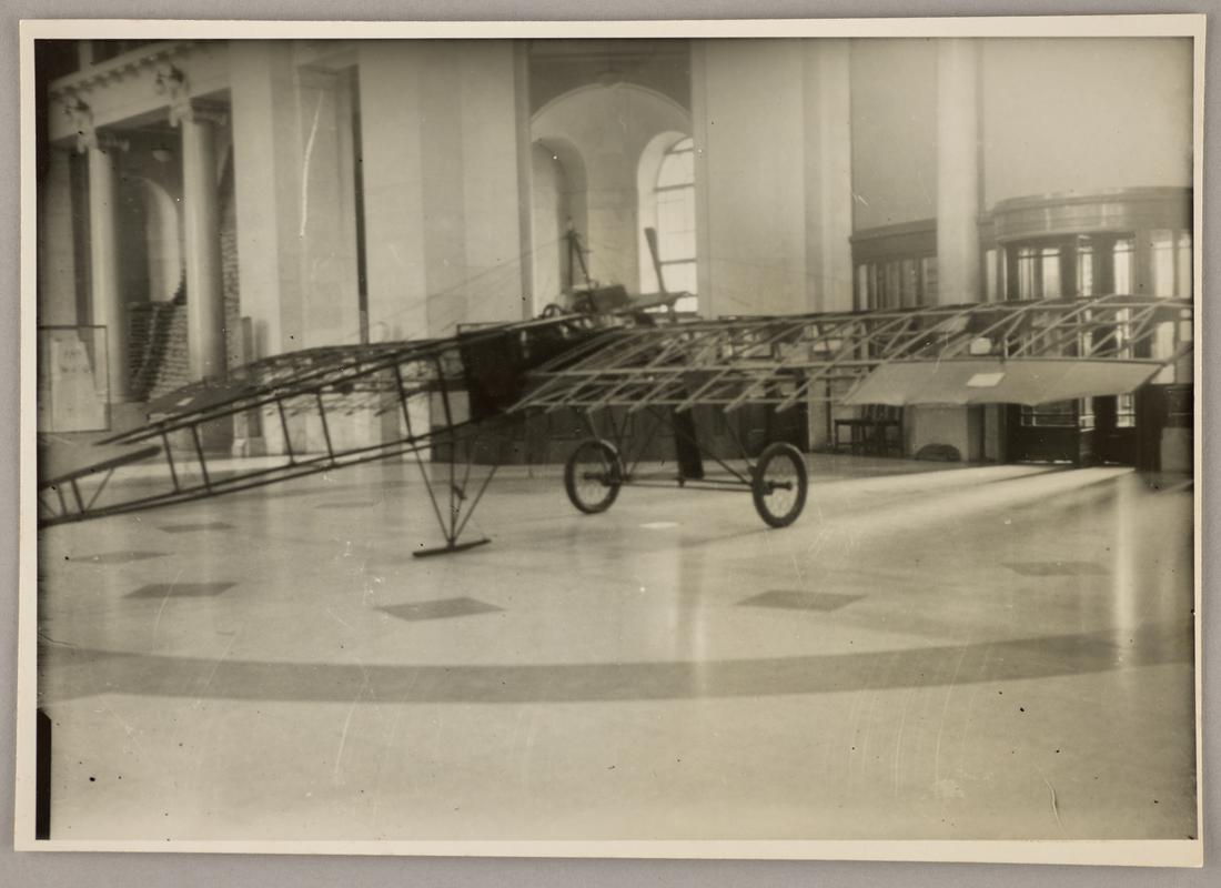 Photograph of Watkins monoplane in the main hall of the National Museum of Wales during the exhibition &#039;Wings for Victory&#039;, 1943. Inscription on reverse.