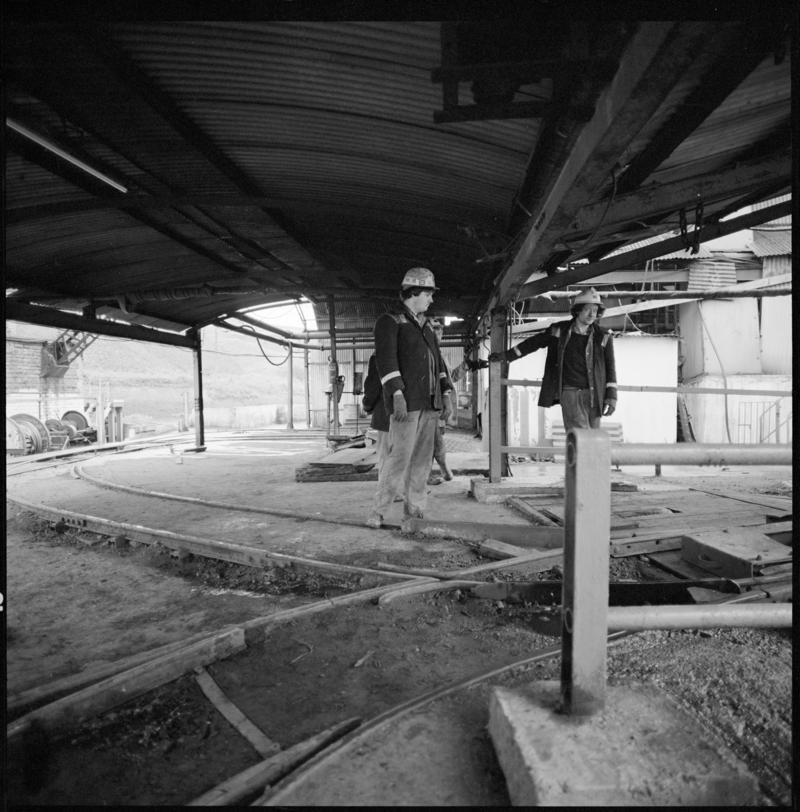 Black and white film negative showing two men at the tub circuit, Coegnant Colliery 25 November 1981.  &#039;25 Nov 1981&#039; is transcribed from original negative bag.
