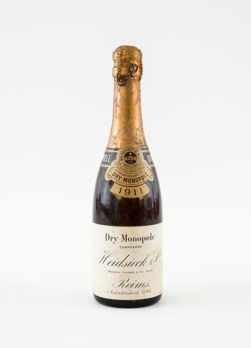 Bottle of champagne. Given to Albert Morgan by Rank Organisation for buying first film for picture house at Oakdale Workmen&#039;s Library and Institute.