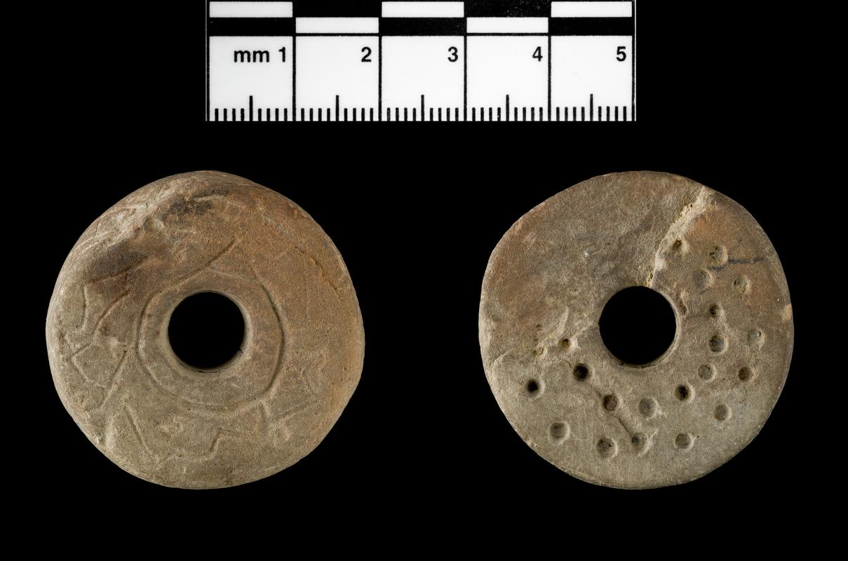 Medieval stone spindle whorl