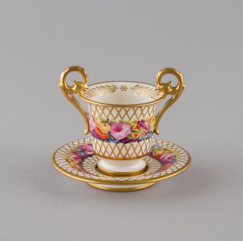 Cup, cabinet and saucer
