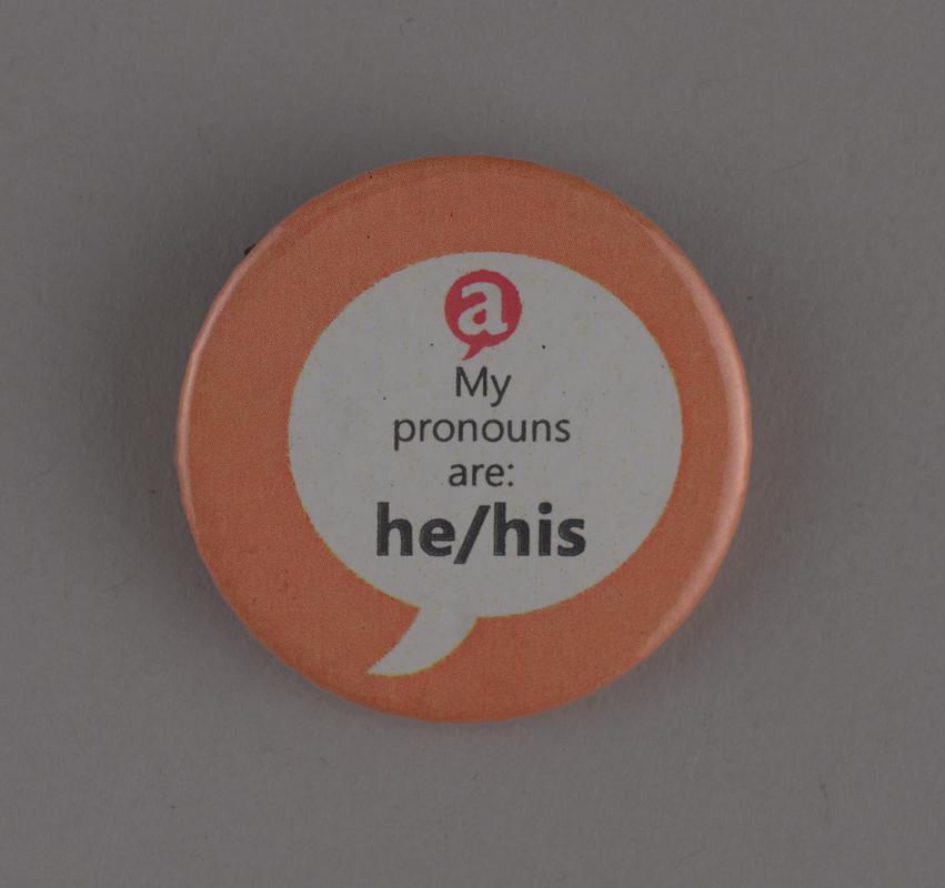 Pronoun badge &#039;He / Him&#039;.