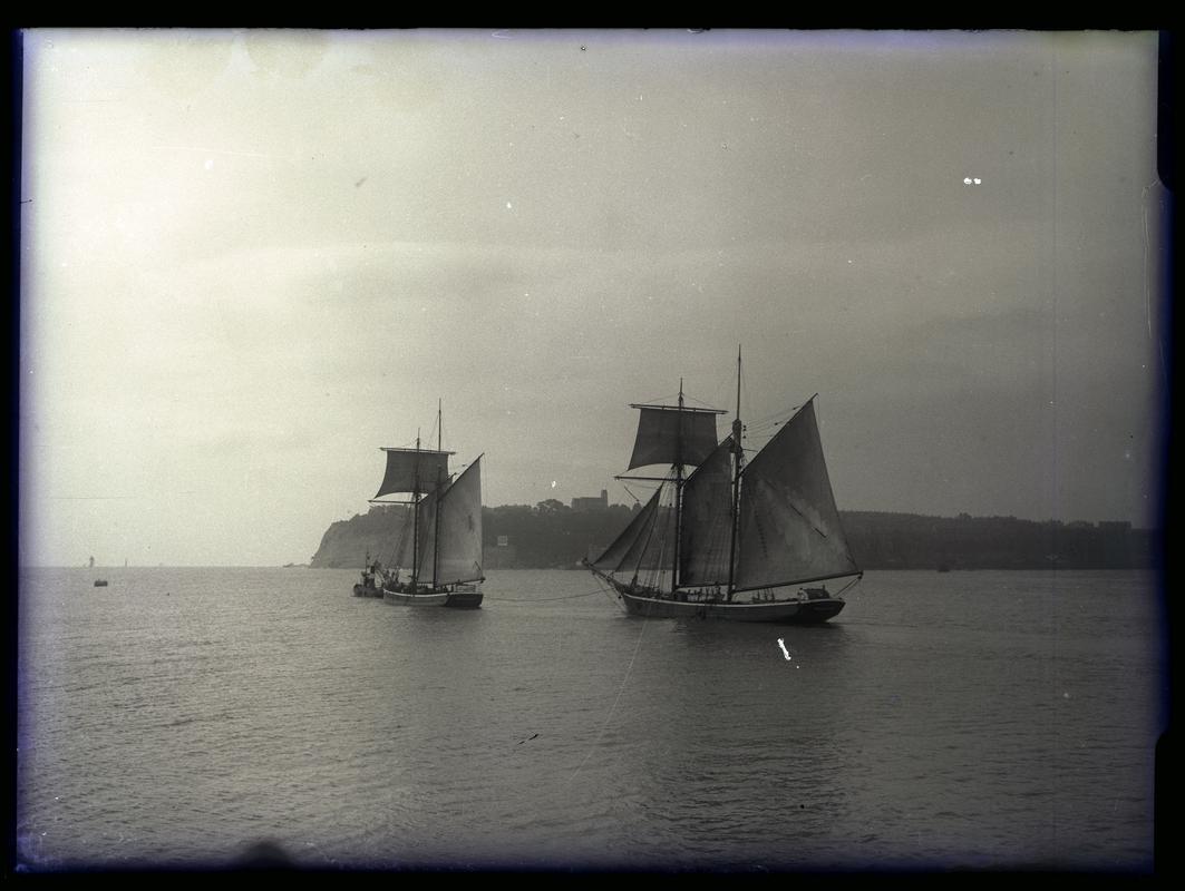 Two 2-masted square-topsail schooners (names unknown) and tug at Penarth Head c.1936.