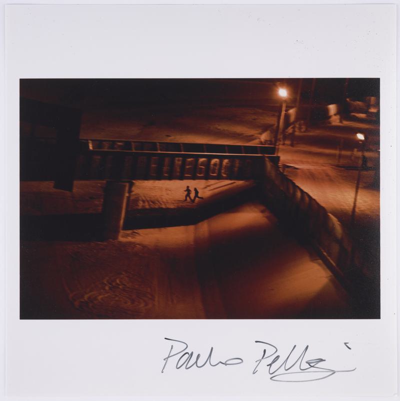 Two men who attempted to enter the U.S. illegally run across the dry Rio Grande riverbed back to Ciudad Juárez, Mexico