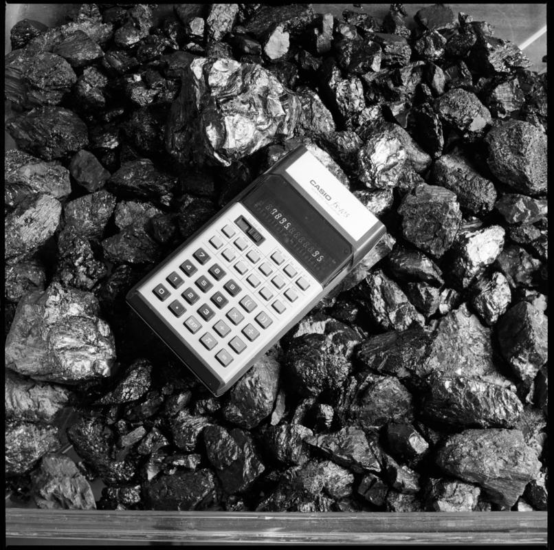Black and white film negative showing a pocket calculator.