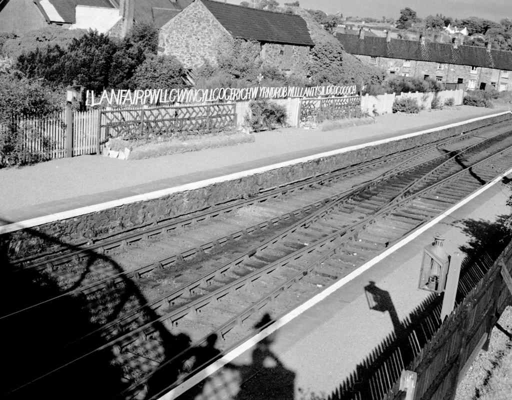 Rustic station name board at Llanfairpwllgwyngyllgogerychwyrndrobwllllantysiliogogogoch railway station