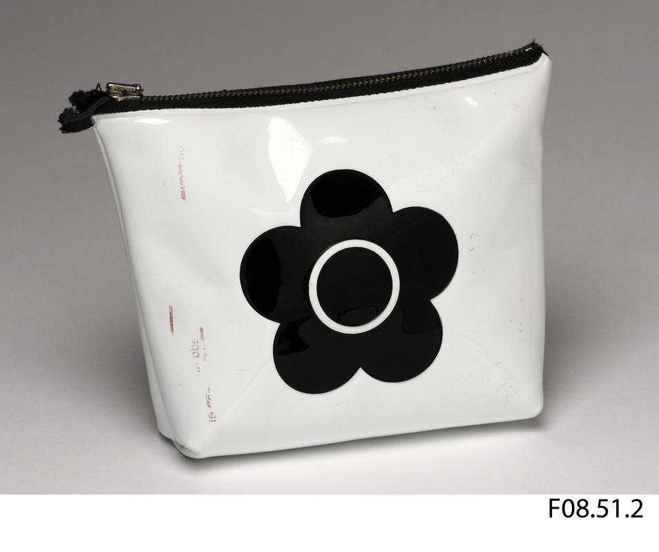 White patent PVC purse with black flower motif on front