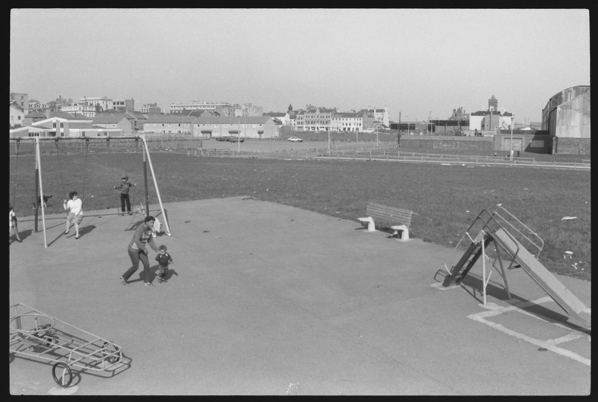 Children&#039;s playground at Louisa Place, with the Welsh Industrial and Maritime Museum building in background. Shows route of proposed new road.