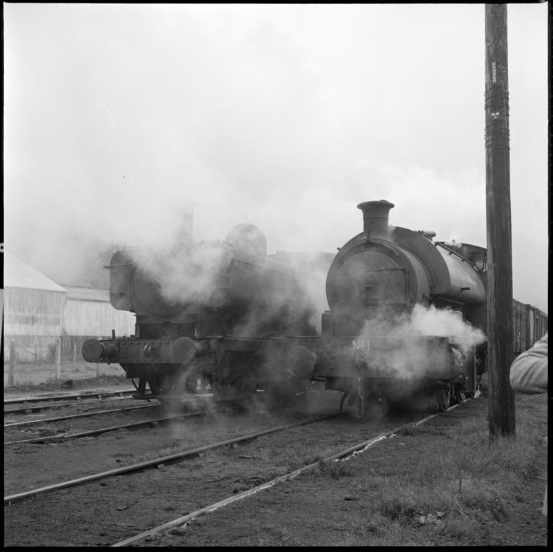 Black and white film negative showing two locomotives at the Mountain Ash locomotive sheds.  &#039;Mountain Ash locos&#039; is transcribed from original negative bag.