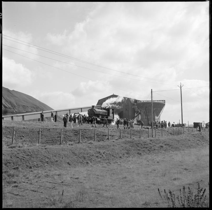 Black and white film negative showing a locomotive passing the washery, Big Pit Colliery.