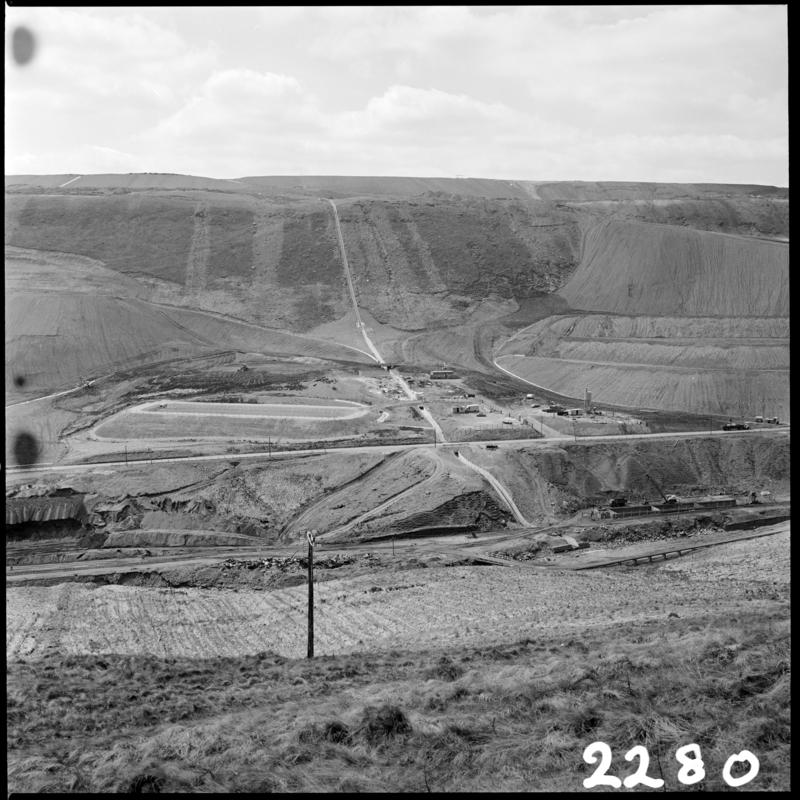 Black and white film negative showing the landscape surrounding Maerdy Colliery.