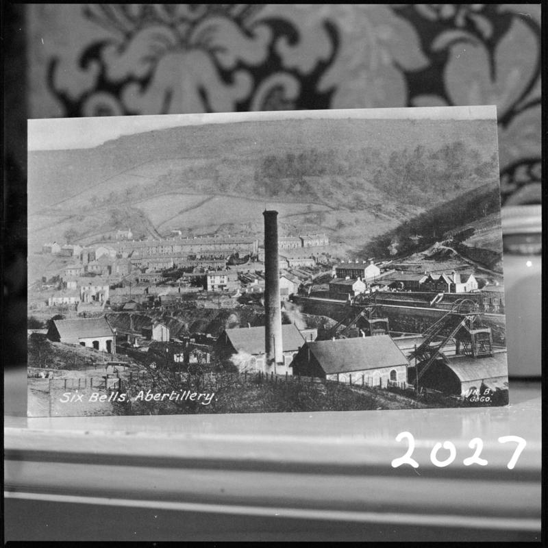 Black and white film negative of a photograph showing a landscape view of Six Bells Colliery, Abertillery and the town. &#039;Six Bells&#039; is transcribed from original negative bag.