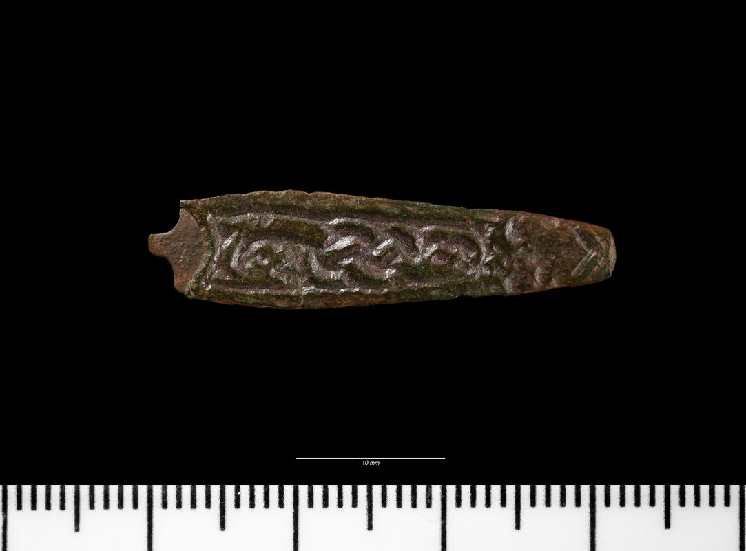 Early medieval copper alloy strap end