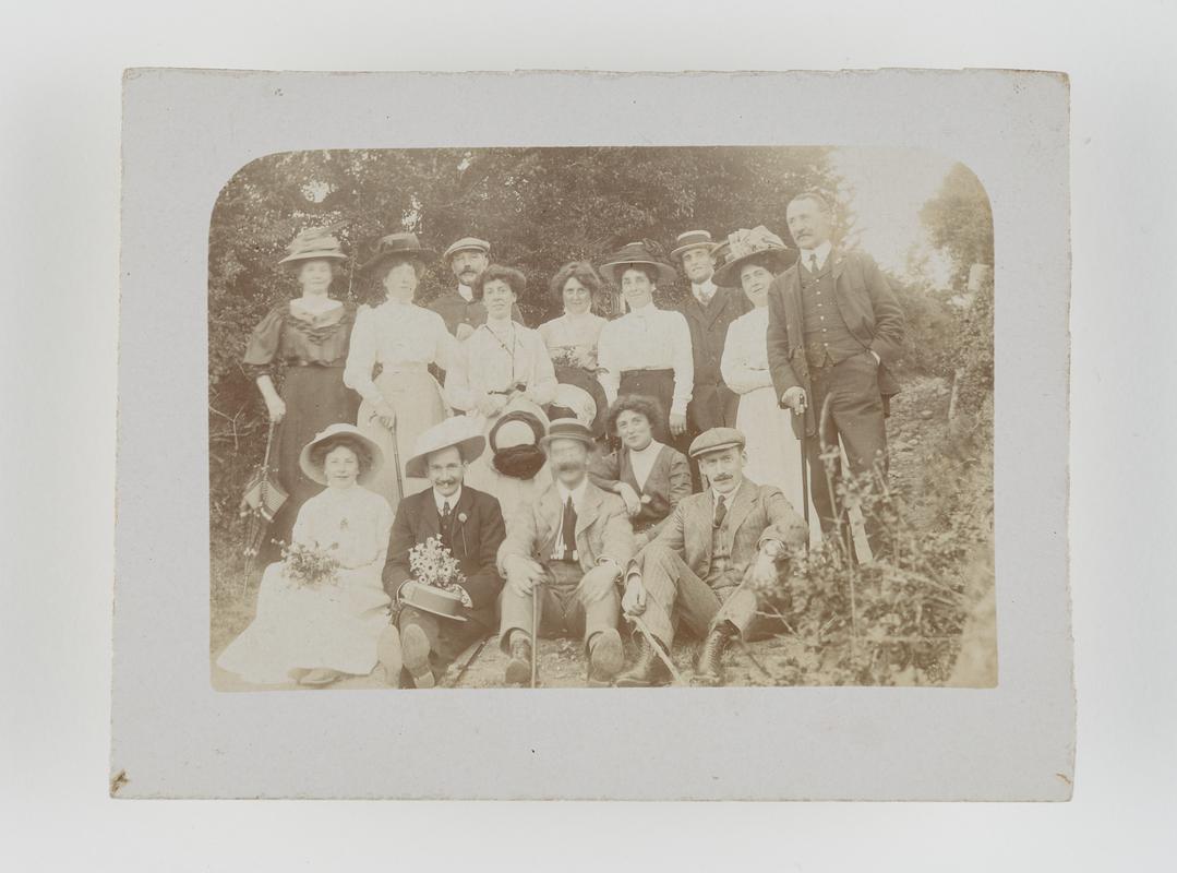 Group of men and women on an outing.