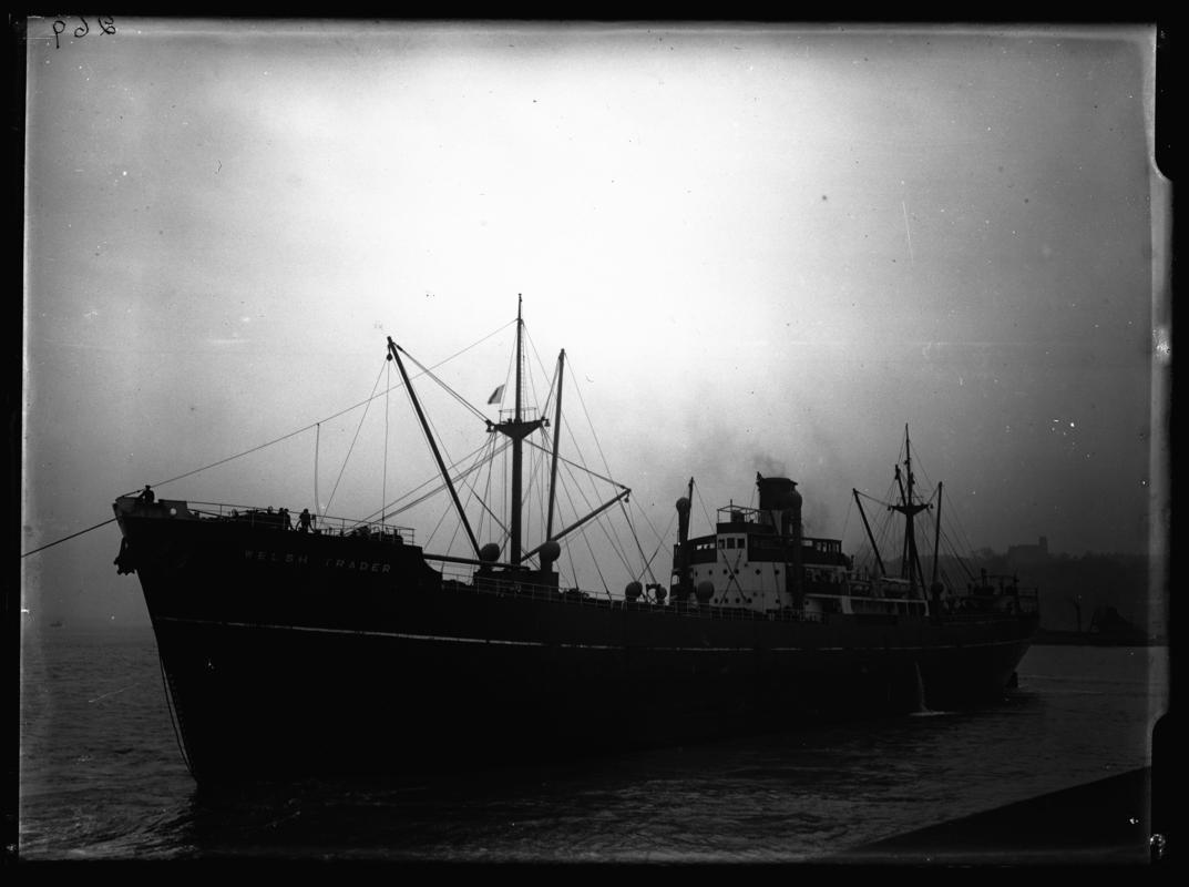 Port broadside view of S.S. WELSH TRADER and dredger at Penarth Head, c.1938.