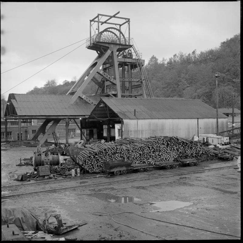 Black and white film negative of a photograph showing Celynen South Colliery downcast headgear and timber yard, 6 November 1985.  &#039;South Celynen 6 Nov 1985&#039; is transcribed from original negative bag.