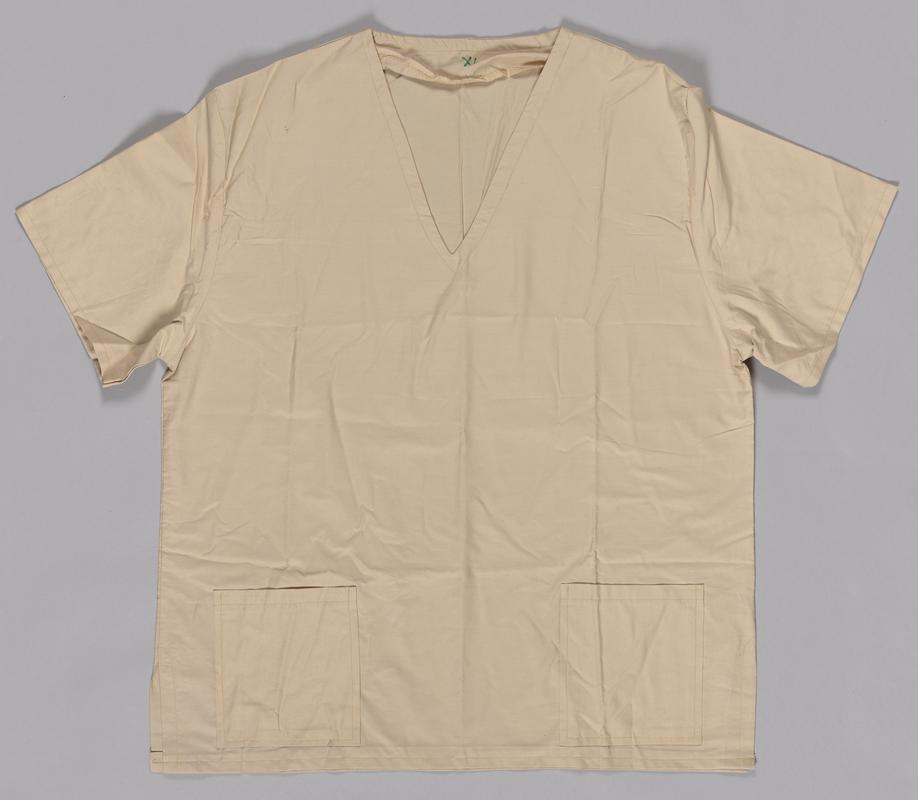 Beige shirt, part of a two piece scrubs set.