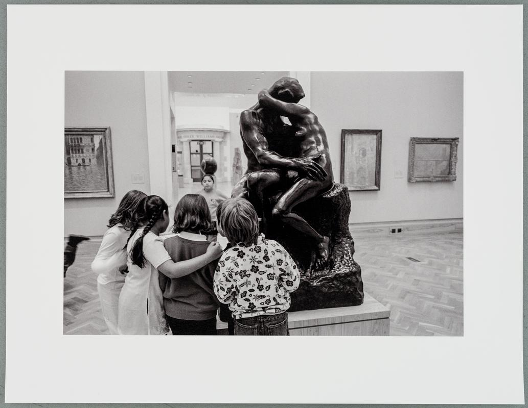 GB Wales. Cardiff. In the National Museum some students from a school party find interest in Rodin&#039;s sculpture &#039;The Kiss&#039;