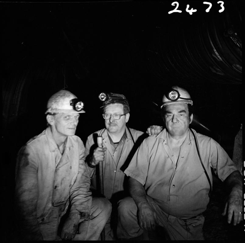 Black and white film negative showing three miners, Merthyr Vale Colliery, 2 July 1981.  &#039;Merthyr Vale 2 Jul 1981&#039; is transcribed from original negative bag.
