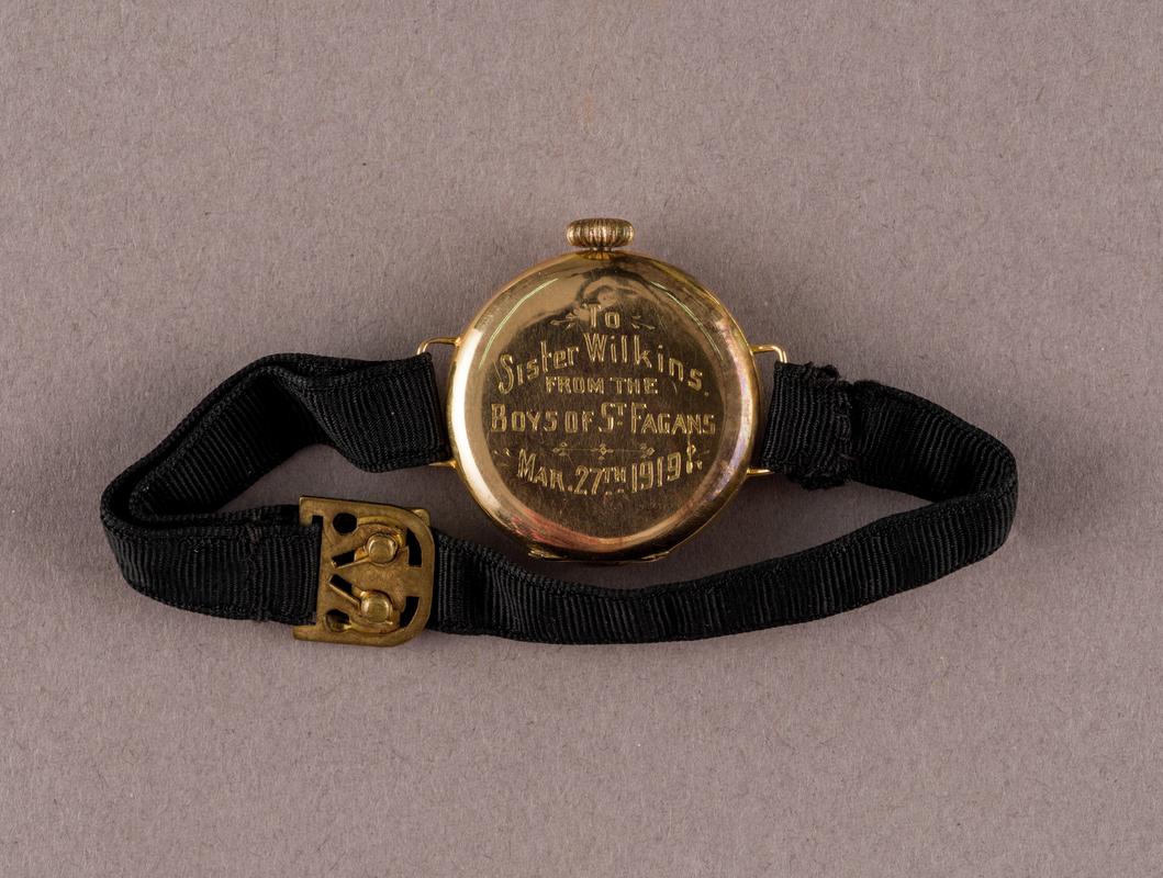 inscription on - Gold wrist watch given to Sister Elizabeth Wilkins by patients at the St Fagans Red Cross VAD Hospital, dated 27 March 1919.