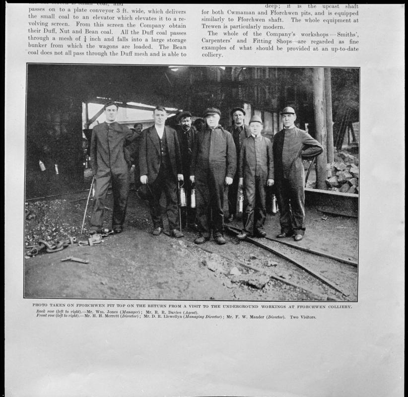 Black and white film negative showing men at pit top after returning from underground, Fforchwen Colliery, photographed from a publication.  &#039;Fforchwen Colliery&#039; is transcribed from original negative bag.