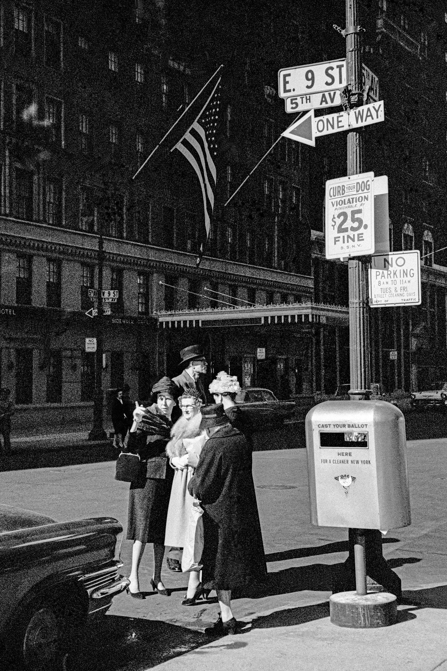 9th street. The affluent await transport. Plus the American Flag. Lower Manhattan, New York USA