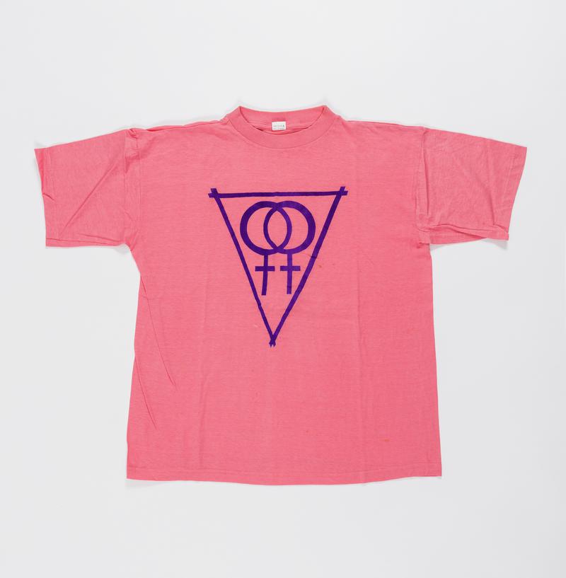 Pink t-shirt with double womens symbol within a triangle. Worn on women&#039;s rights marches and Pride.
