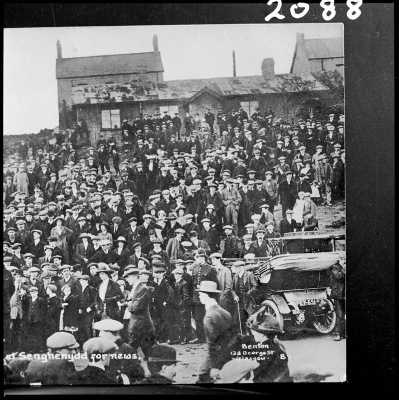 Black and white film negative of a photograph showing the crowd waiting for news at Universal Colliery, Senghenydd following the explosion of 14 October 1913.