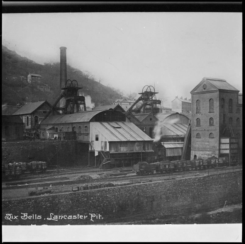 Black and white film negative showing a surface view of Six Bells Colliery c.1910.  The tall building on the right was the washery.  &#039;Six Bells&#039; is transcribed from original negative bag.