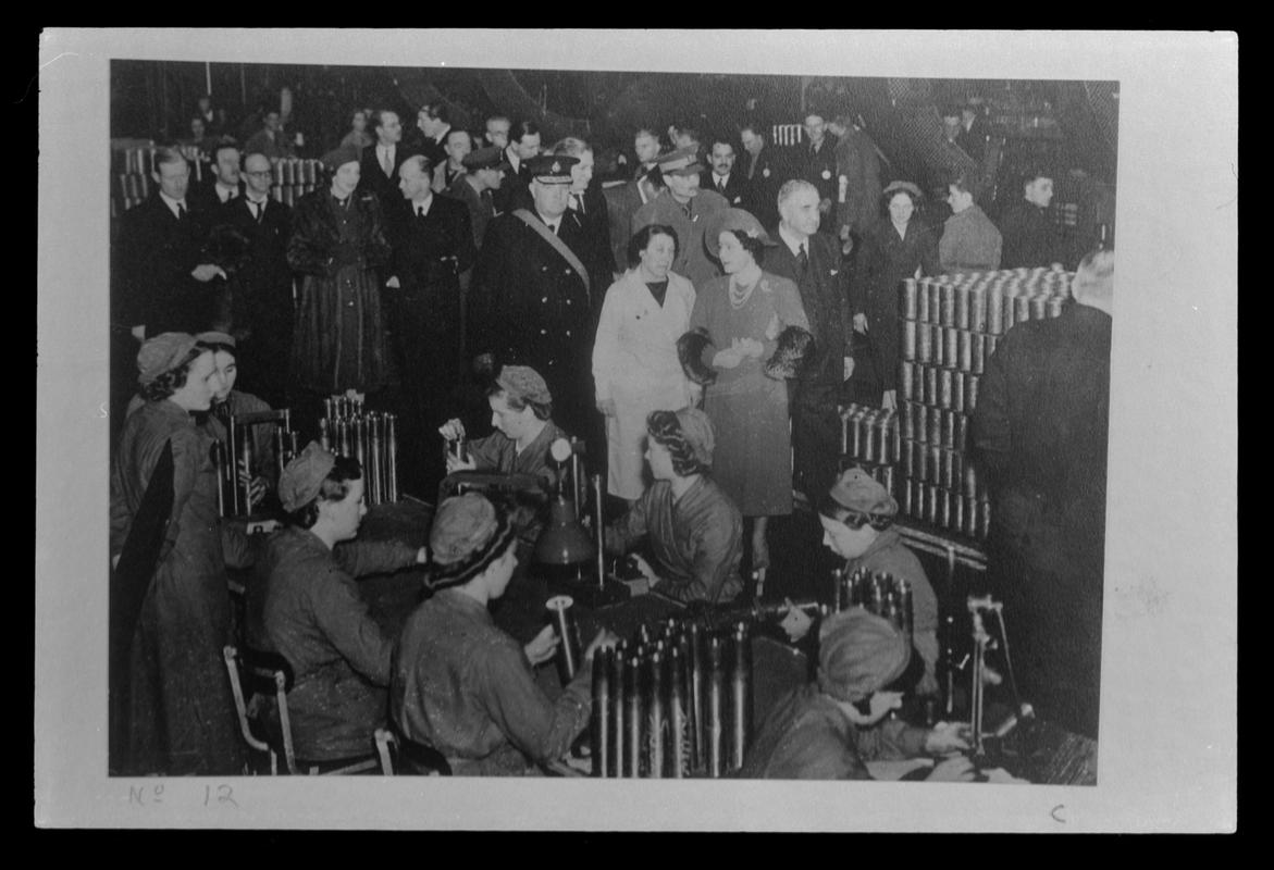 Film negative of a photograph showing visit of King George VI and Queen Elizabeth to Currans, Butetown during World War II.