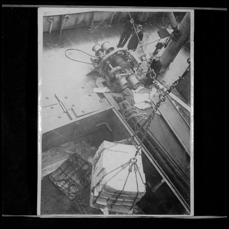 A deck winch lowering the cargo into the hold of S.S. OCEAN VANGUARD