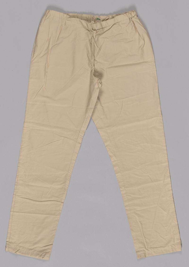 Beige trousers, part of a two piece scrubs set.