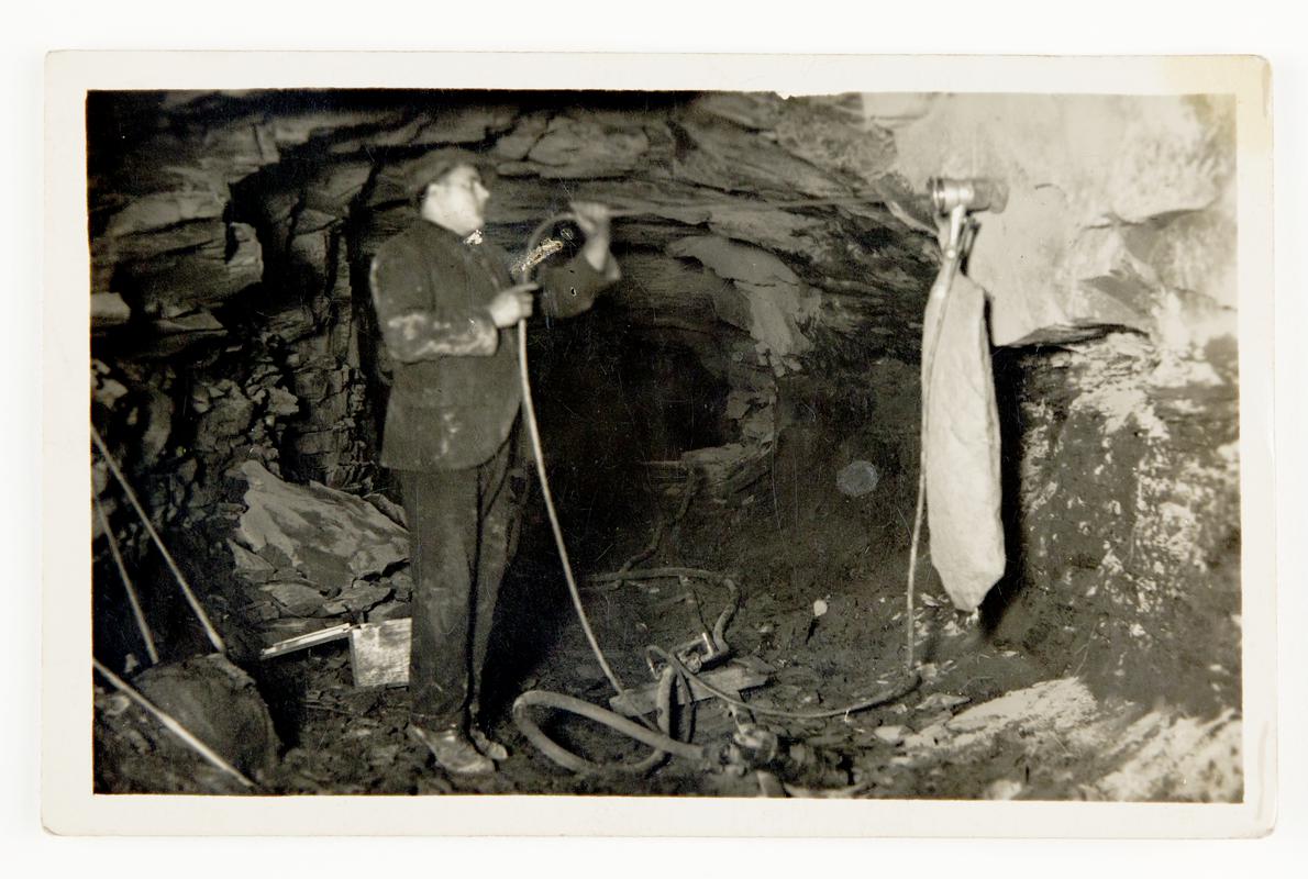 Photograph showing Stan Williams&#039; dust trap invention in action underground.