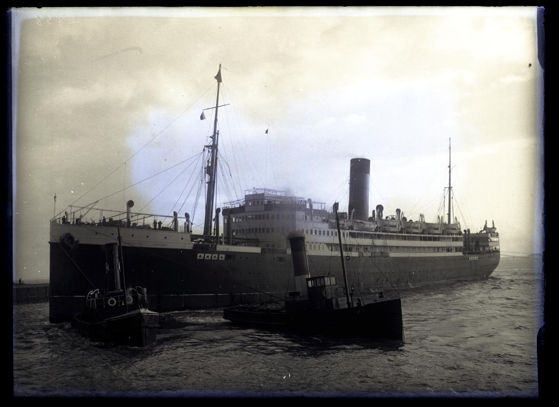 3/4 Port Bow view of S.S. CRISTOLBAL COLON, with 2 tugs c.1936.