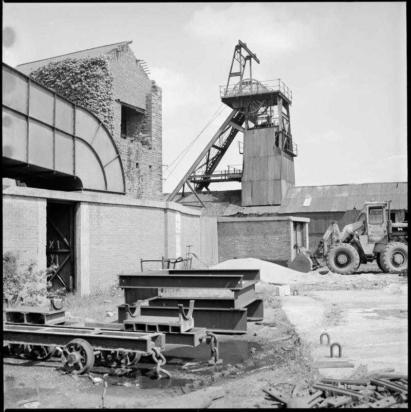Black and white film negative showing a surface view of Morlais Colliery, including the derelict pumping house which contained a beam pump. &#039;Morlais&#039; is transcribed from original negative bag.