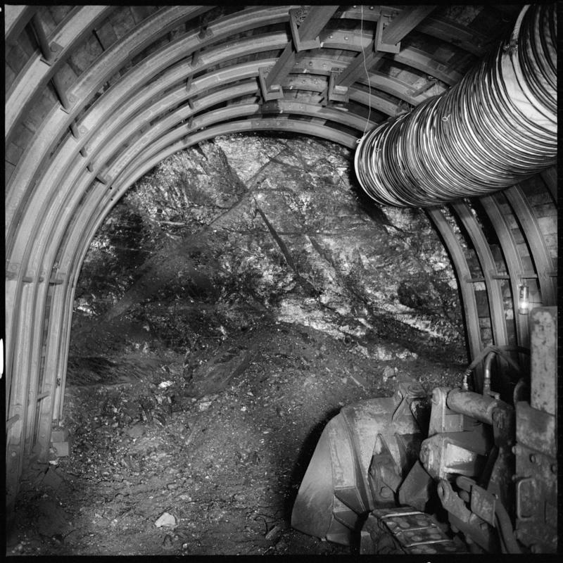 Black and white film negative showing an Eimco machine in a development heading, possibly in the Nine Feet seam, Blaengwrach Mine, 1 November 1979.  &#039;Blaengwrach 1 Nov 1979&#039; is transcribed from original negative bag.  Appears to be identical to 2009.3/1337