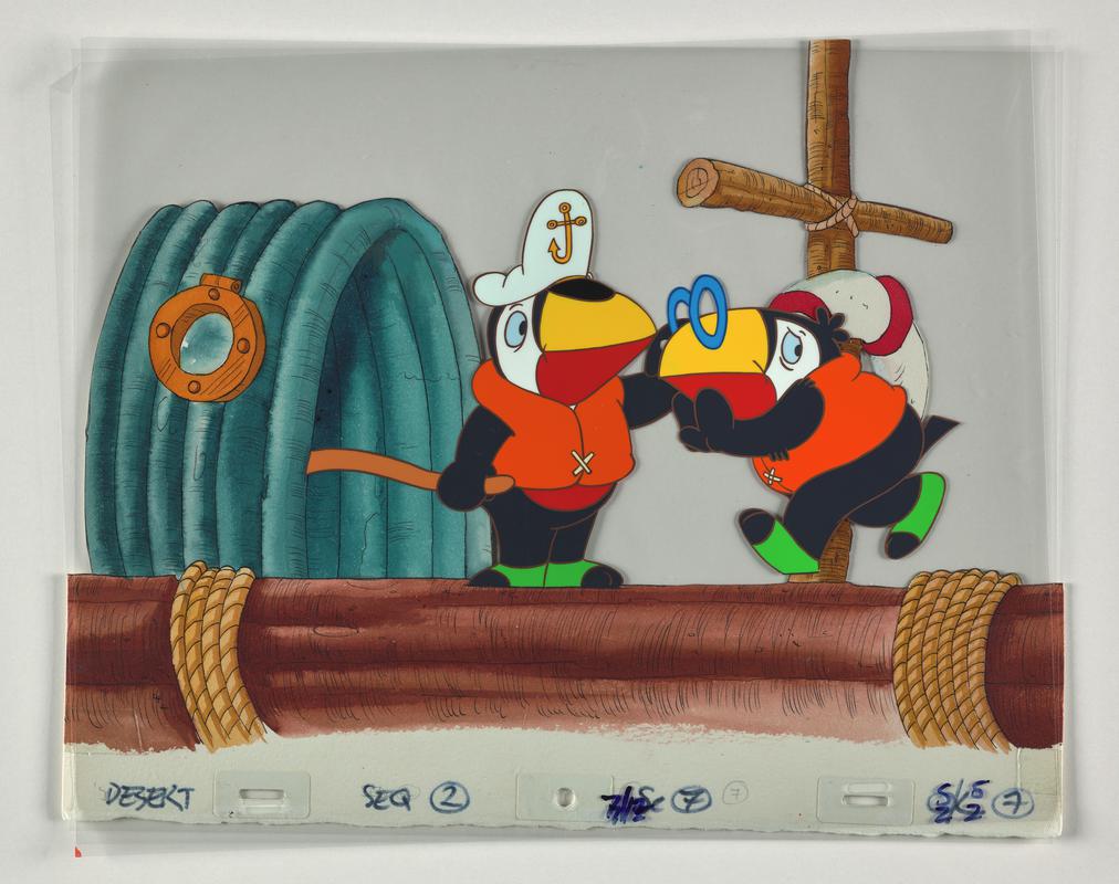 Toucan Tecs animation production artwork showing the characters Zippi and Zac. Card background overlaid with two sheets of cellulose acetate.