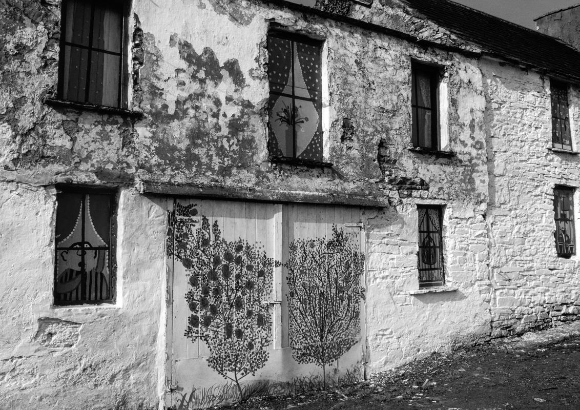 IRELAND. Ennistimon. Wall painting around the town often financed with help from local arts lovers. 1984.