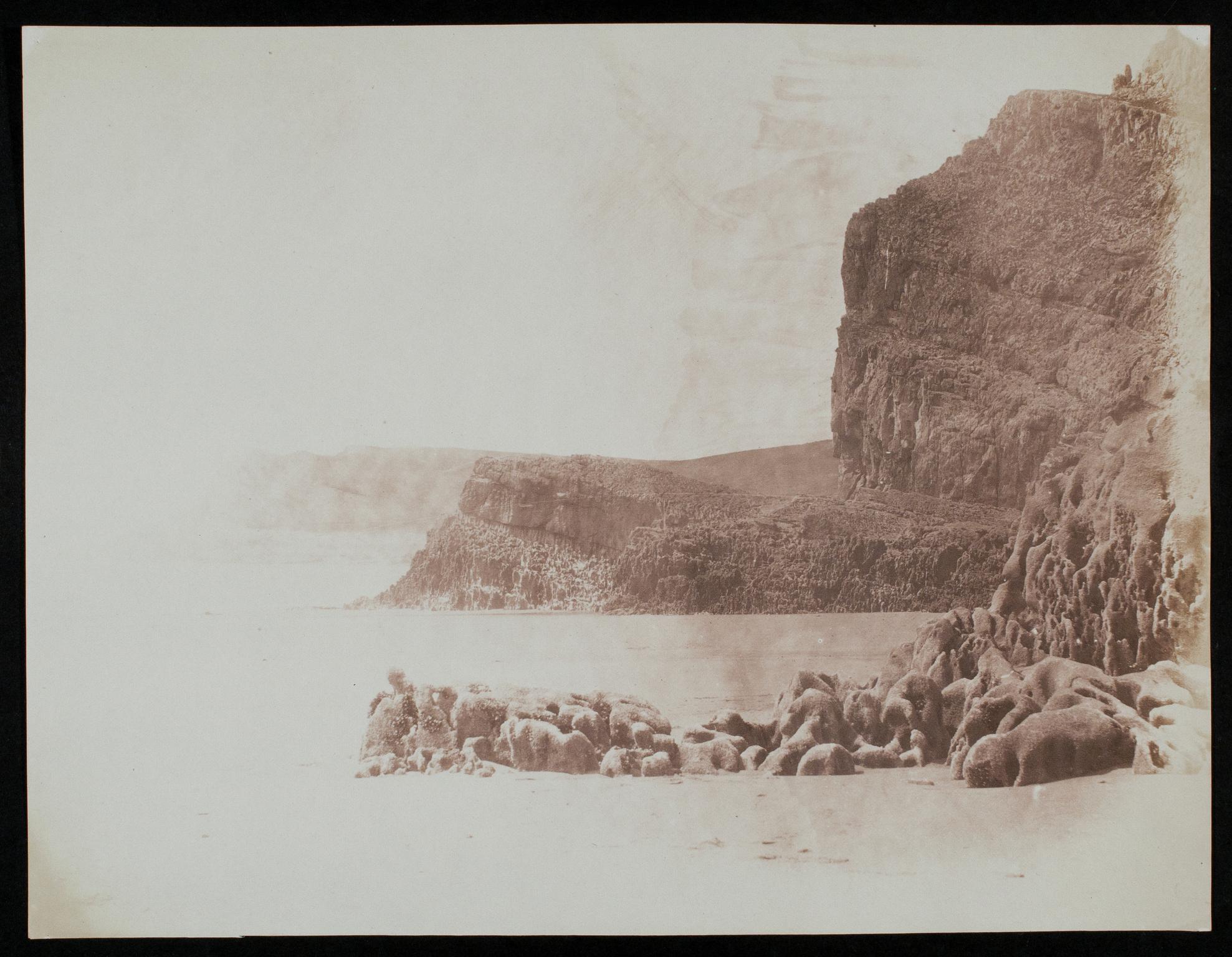 Beach with cliffs, photograph