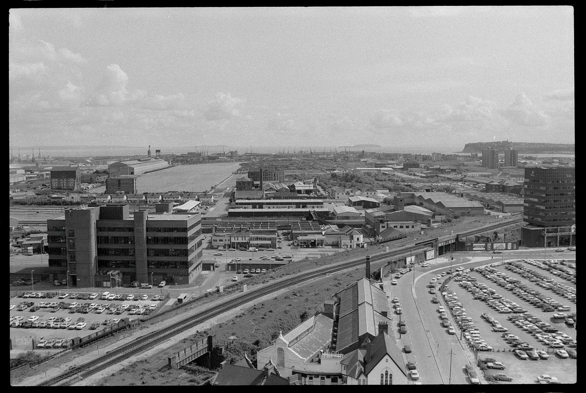 View from top of building on Churchill Way, looking south over railway line to Bute Road with Penarth Head in background.