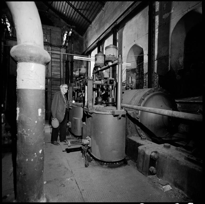 Black and white film negative showing George Watkins in the winding engine house, Elliot Colliery.  &#039;East Elliot&#039; is transcribed from original negative bag.