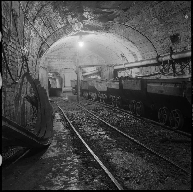 Black and white film negative showing coal drams underground at Nantgarw Colliery.  &#039;Nantgarw&#039; is transcribed from original negative bag.
