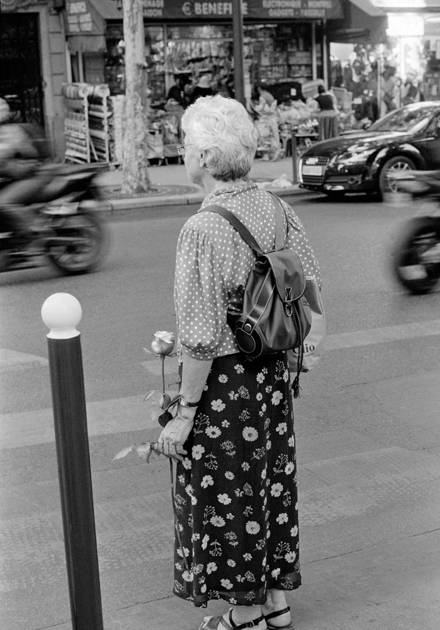 Woman with flower. Cardiff, Wales