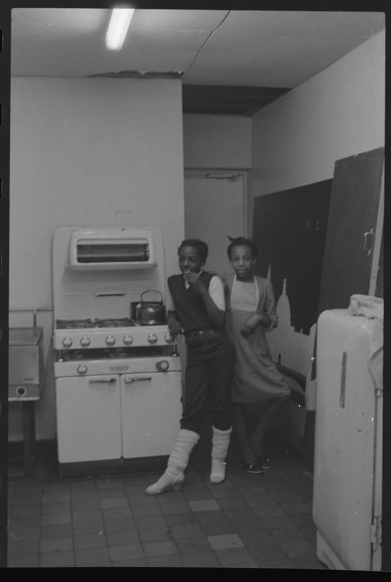 Two girls in kitchen of Butetown Youth Club.