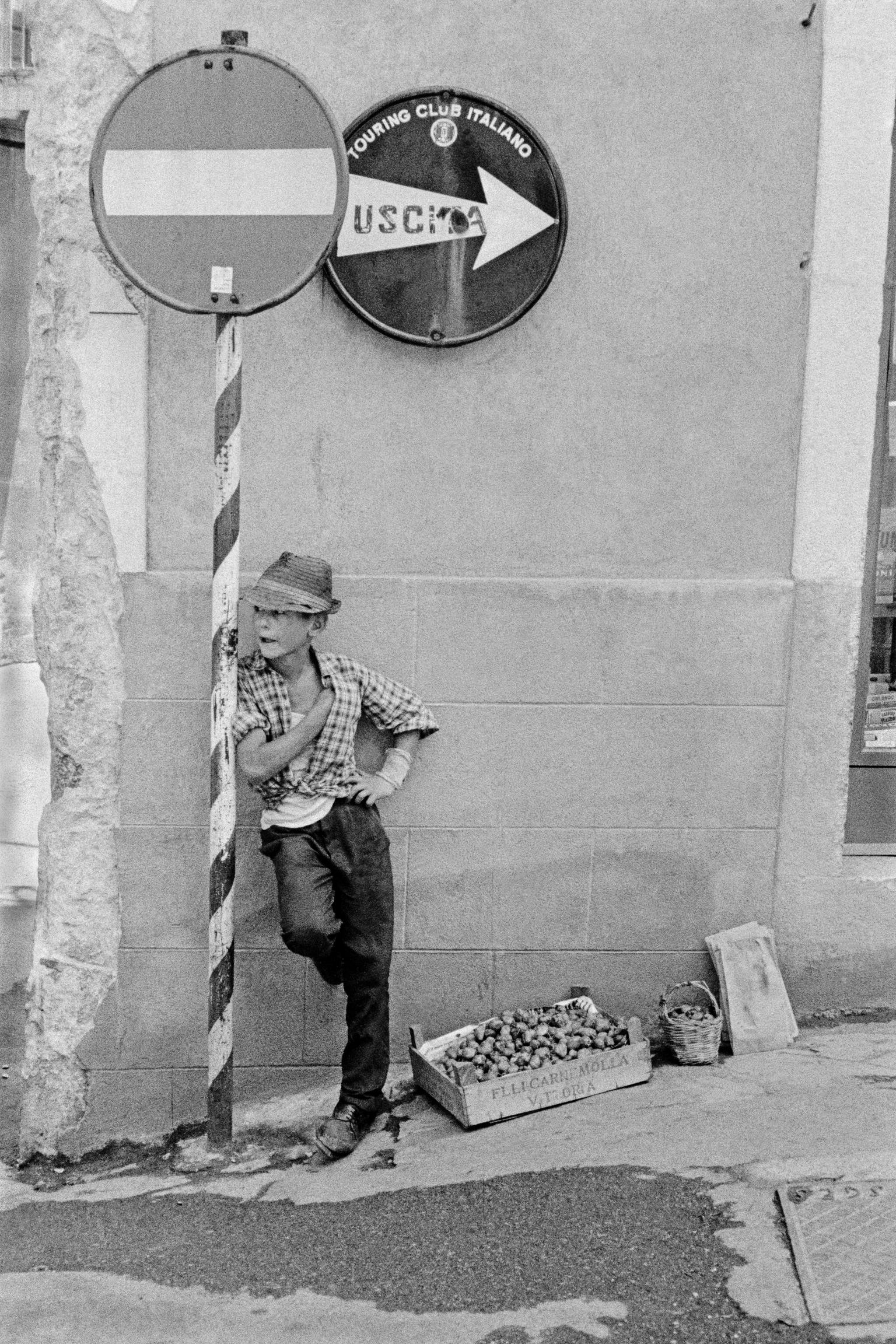 Young fruit seller. Taormina, Sicily. Italy