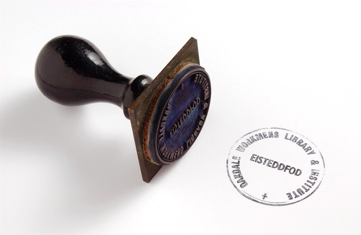 Handstamp used by Eisteddfod Committee at the Oakdale Workmen&#039;s Institute c. 1914-1922.